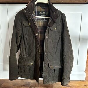 Authentic Barbour women’s waxed jacket with the original Barbour Tartan.